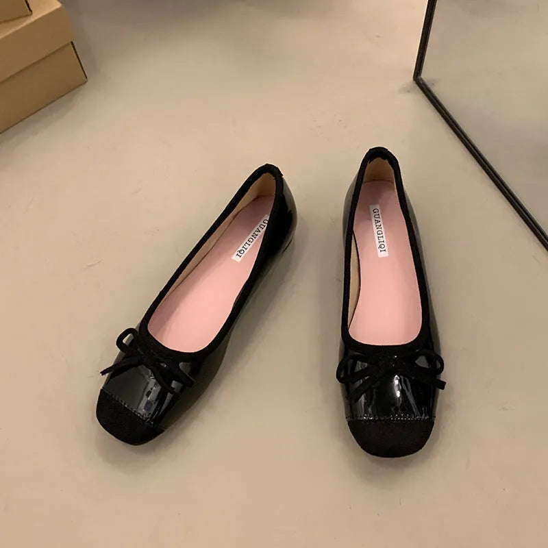 Retro apricot colour Mary Jane ballet flats with bow detail and square toe on a white background.