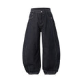 Men's wide leg denim trousers in original cow colour on a hanger, showing the relaxed fit and mid waist design.