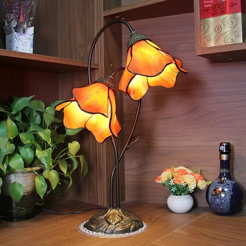 Retro American glass lotus desk lamp with double head pink shade on table