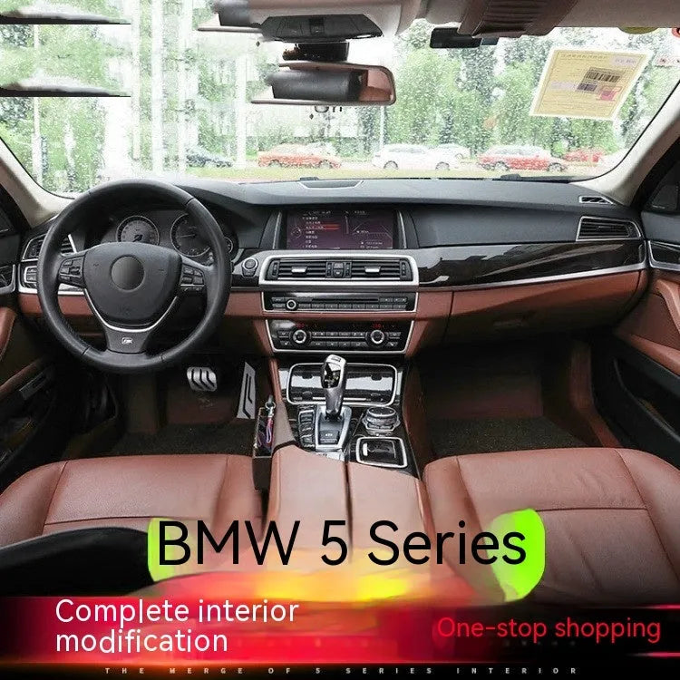 Set of four metallic silver trim strips for BMW 5 Series interior door handles.