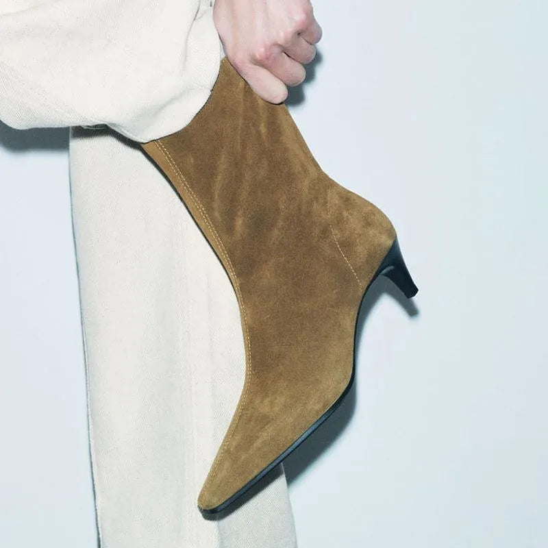 Brown women's retro ankle boots with a square toe, side zip, and a mid-height stiletto heel on a white background.