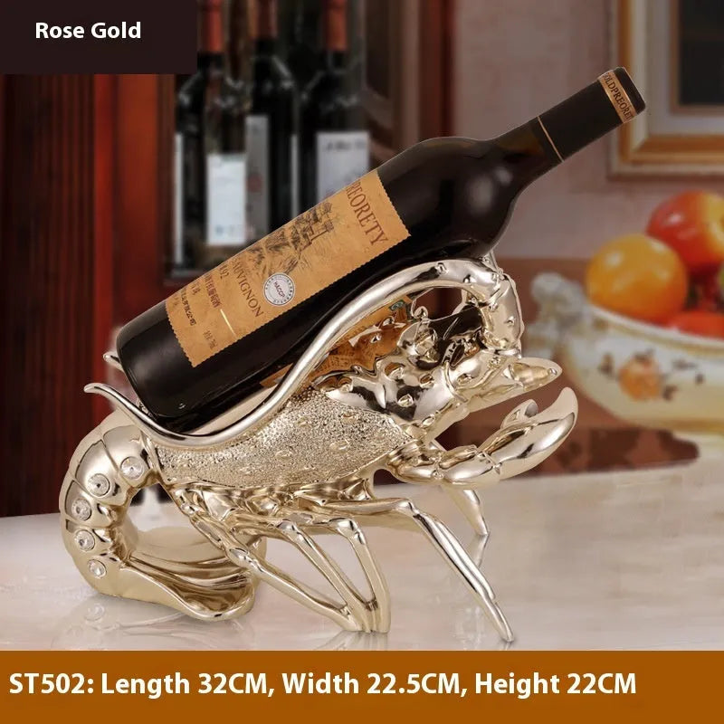 Lobster-shaped wine rack ornament in rose gold or silver resin finish on a table.