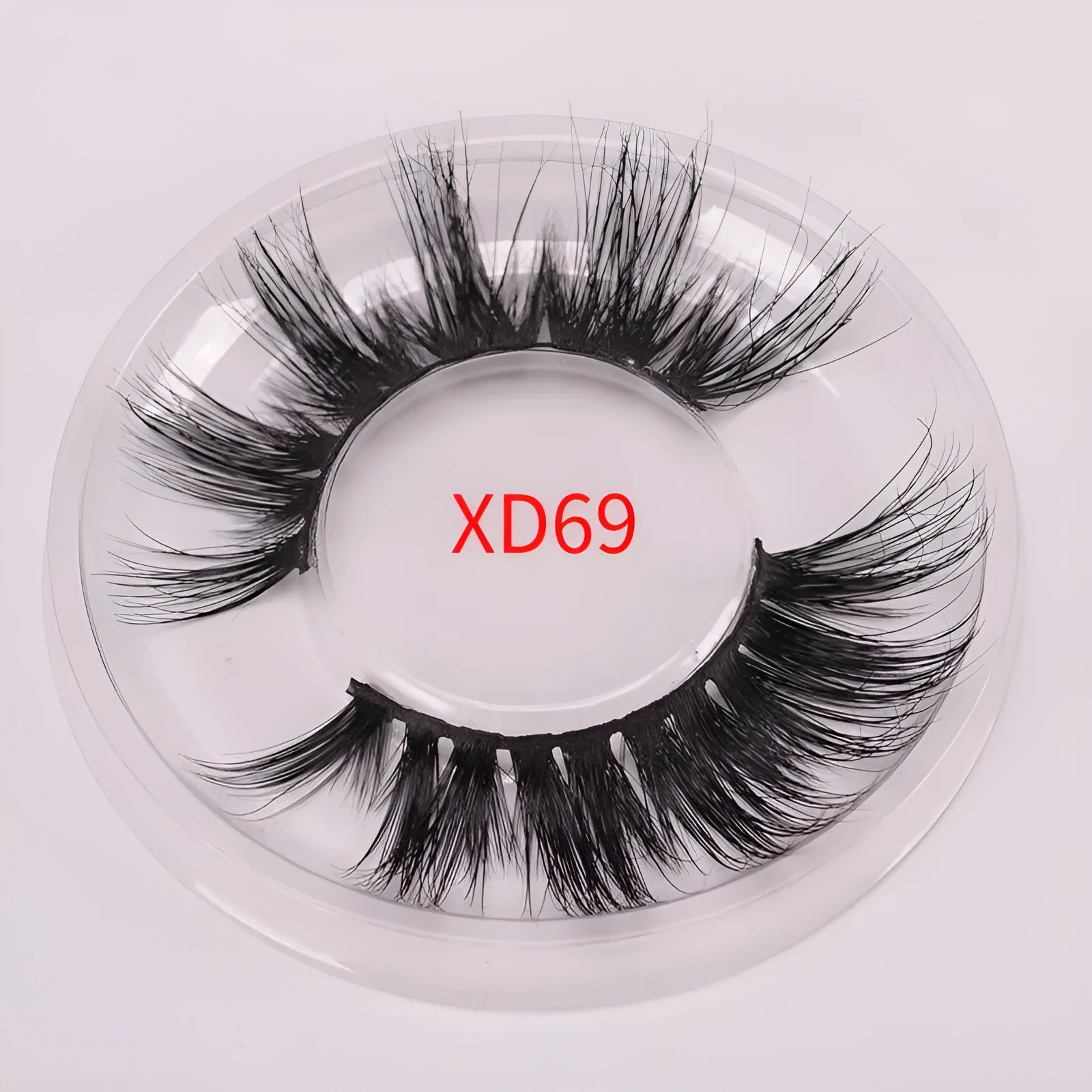 Handmade 5D mink false eyelashes set with storage case and double-headed brush on a clean background.