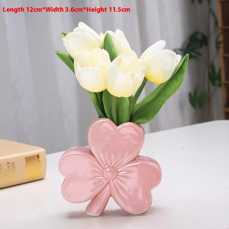A white porcelain ceramic vase in European style for desktop decoration.