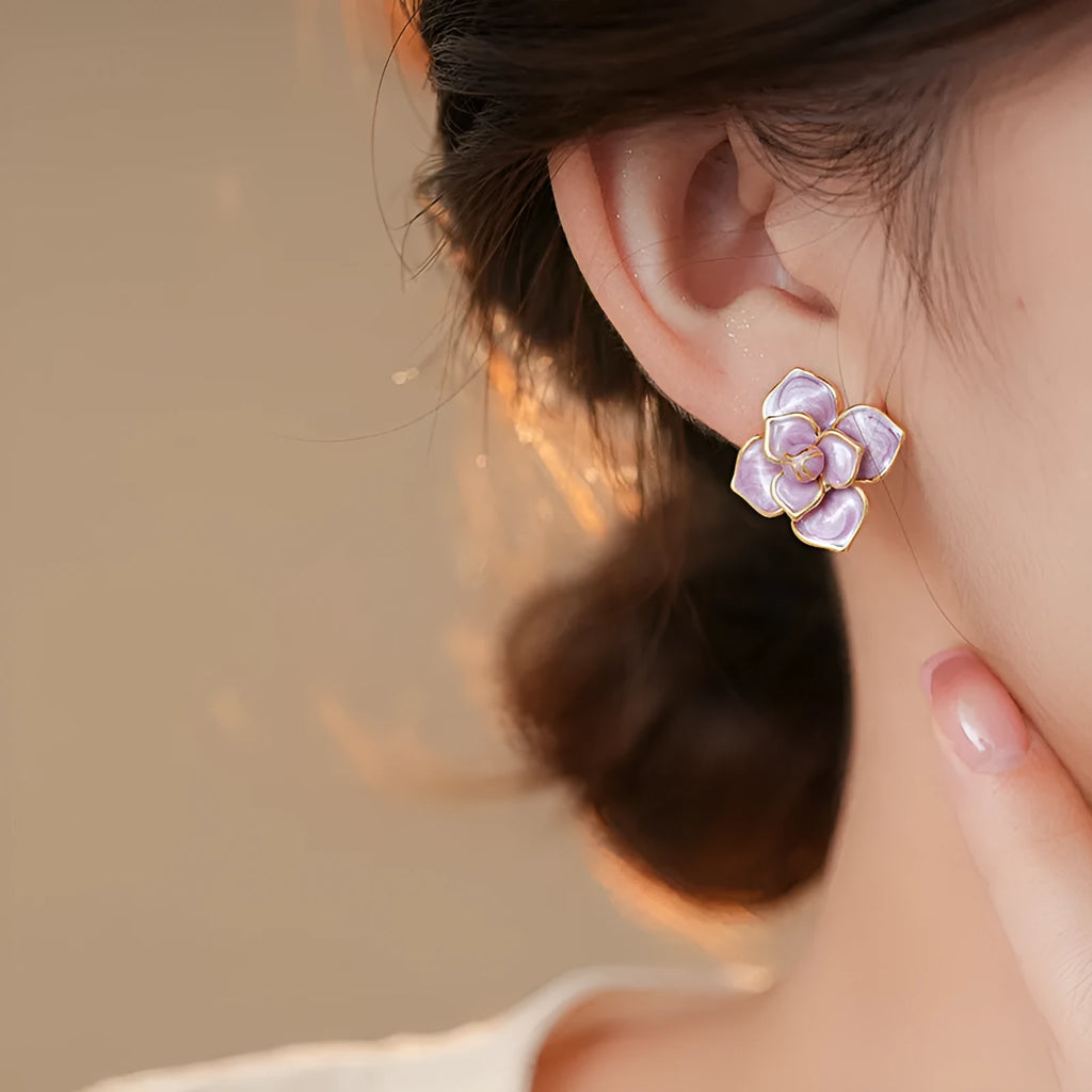 Gold plated purple oil-spot glaze flower stud earrings with copper construction and fresh floral design