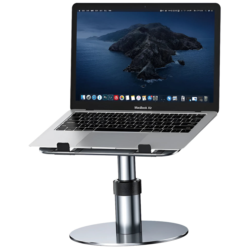 Silver adjustable laptop stand with 360-degree rotating base on a wooden desk.