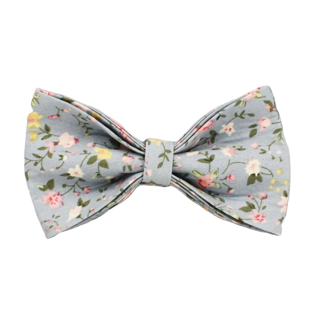 Blue floral patterned cloth dog collar with matching leash and vest set on a white background.
