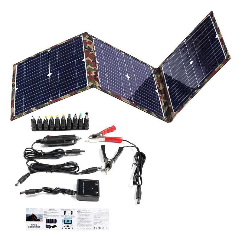 Black foldable 36W portable solar panel with car charger and USB hub accessories on a table.