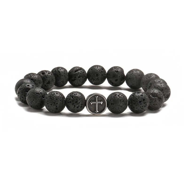 Geometric volcanic rock agate bracelet with stainless steel finish on a wrist.