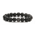 Geometric volcanic rock agate bracelet with stainless steel finish on a wrist.