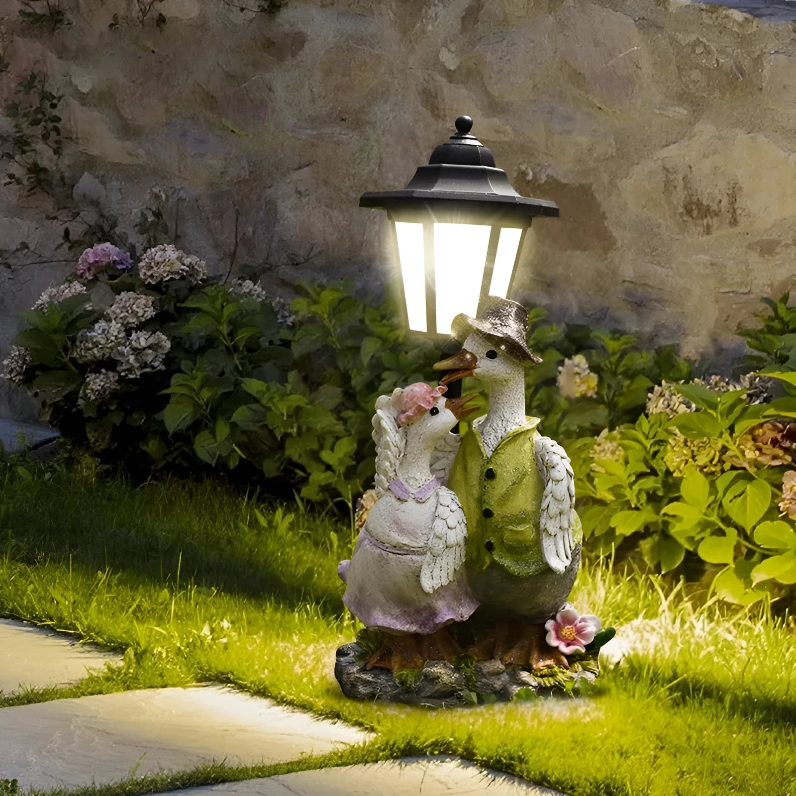 Solar powered decorative garden lamp with synthetic resin animal sculpture design