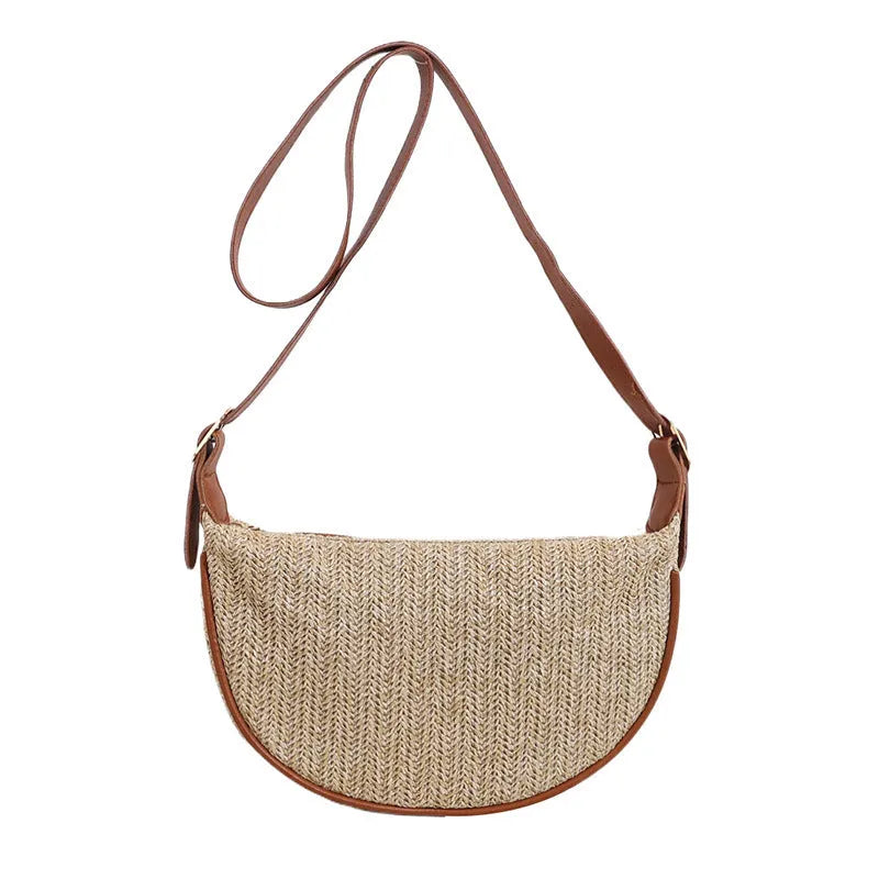 Women's woven straw crossbody bag showing internal phone compartment and file pocket in milky white colour