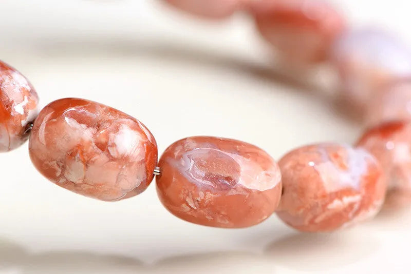 Natural cherry agate barrel bead bracelet with geometric beads and Ruyi charm