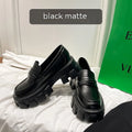 A pair of British style wide fit loafers with a muffin heel, shown in patent leather and matte colour options.