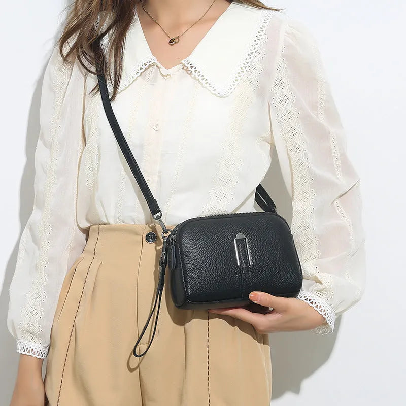 Genuine cowhide leather women's shoulder bag in horizontal square shape, 19x13x6cm, shown in a neutral colour.