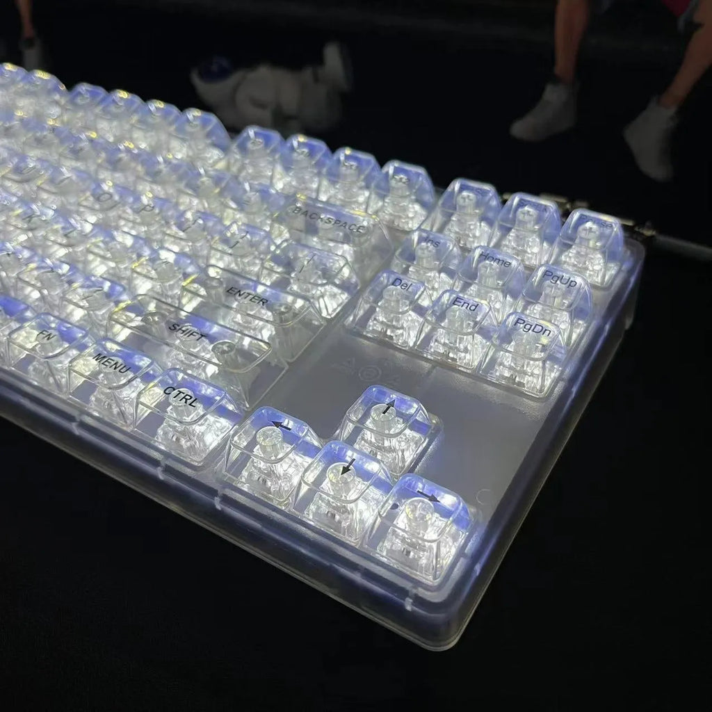132 transparent plastic key caps arranged for a full-size keyboard layout