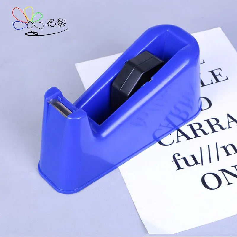 Dual-purpose tape cutter with PS body and stainless steel blade on a desk