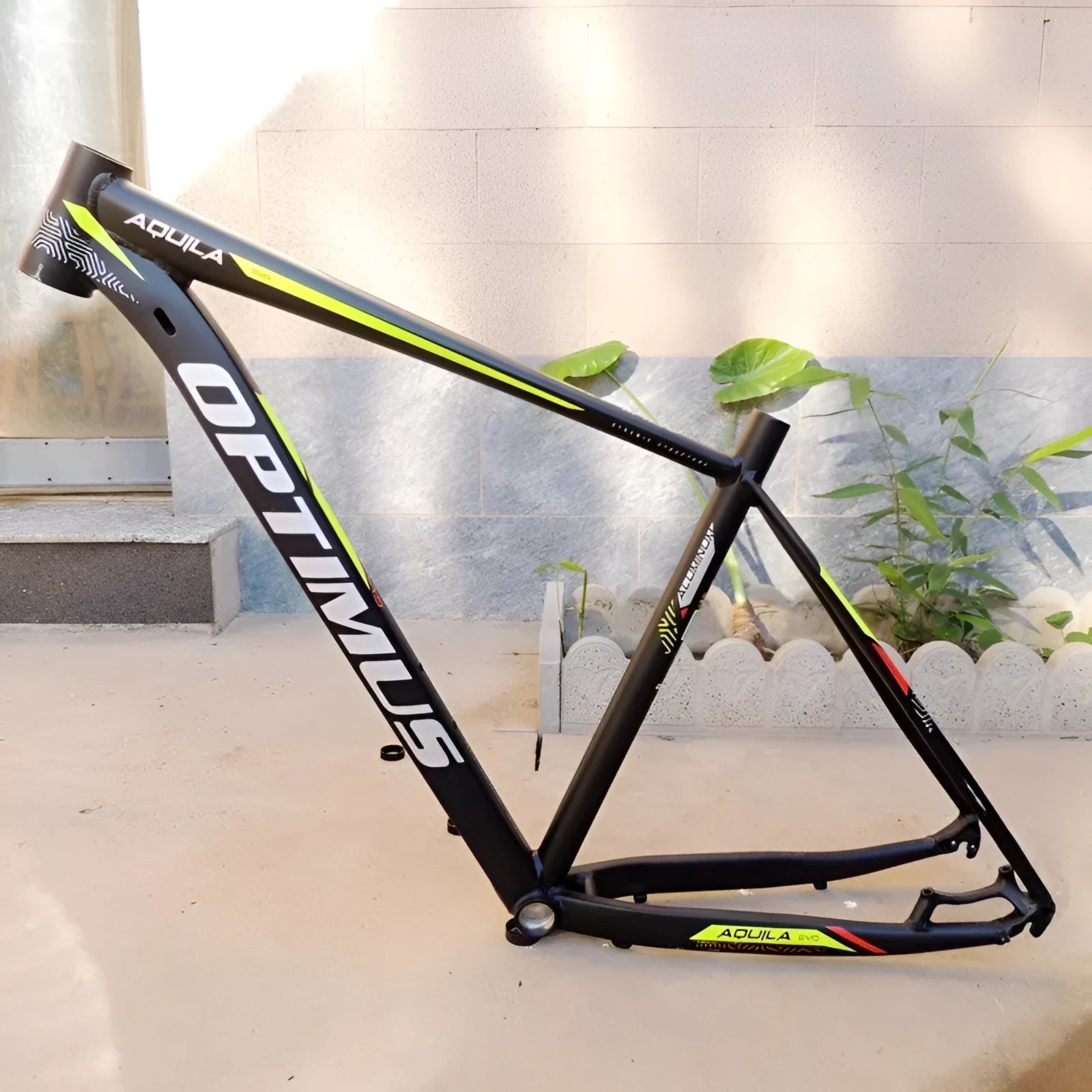 Black green aluminium 29-inch mountain bike frame showing innerline routing and disc brake mounts