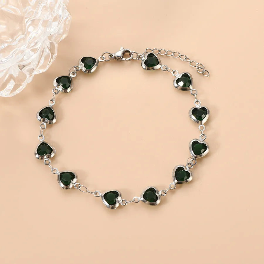 Devil's Eye Creative All-match Fashion Heart Bracelet in stainless steel on a wrist.