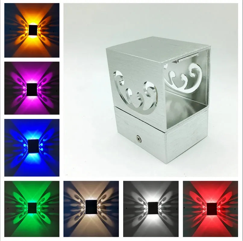Modern aluminium LED butterfly wall lamp with remote control for seven different light colours.