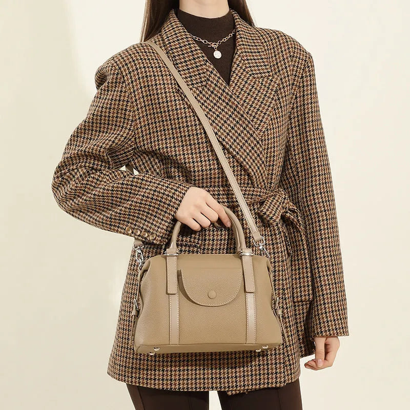 Genuine leather ladies handbag in black, brown, or elephant grey with lock detail and shoulder strap