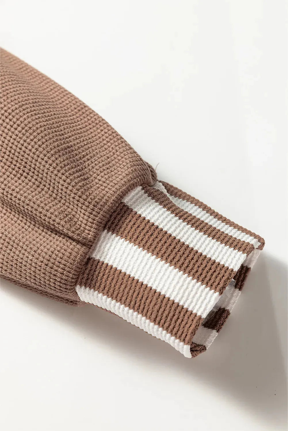 Straw yellow hoodie with waffle texture striped patchwork design featuring drawstring hood and button neck closure