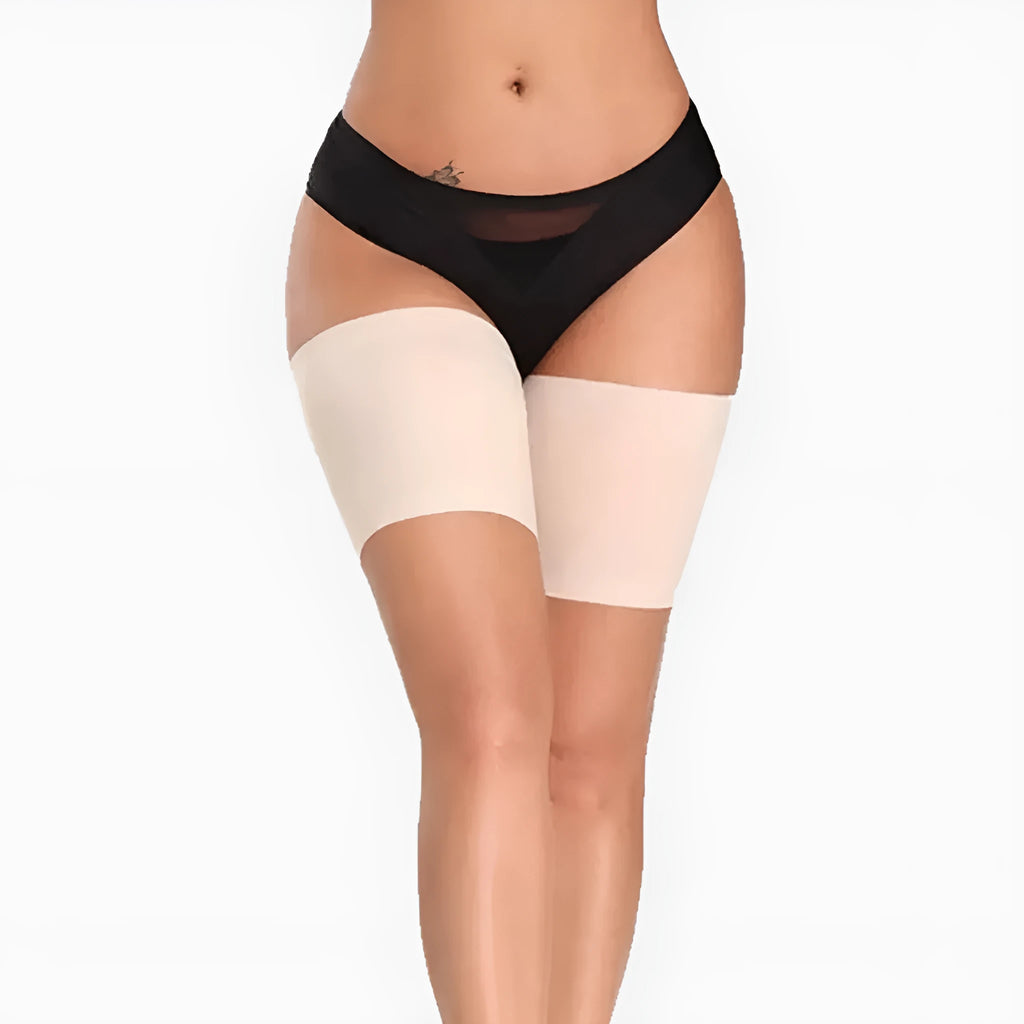 Women's anti-friction silicone thigh strap in black with adjustable nylon band on plain background