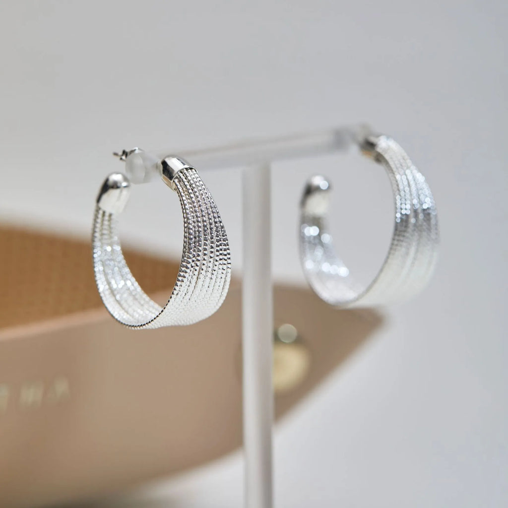 Geometric multi-layer earrings with electroplated gold or silver finish and clip or stud backings