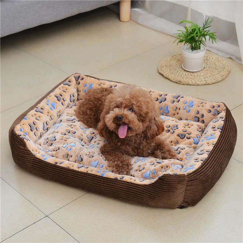 Beige plush bolster dog bed for small dogs on a wooden floor, showing non-slip bottom and raised sides.