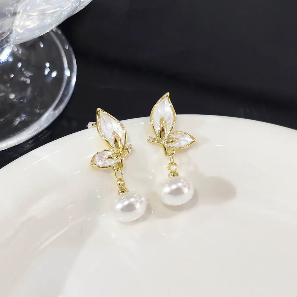 A pair of women's butterfly earrings in colour PT0203, made from copper with zircon painting.
