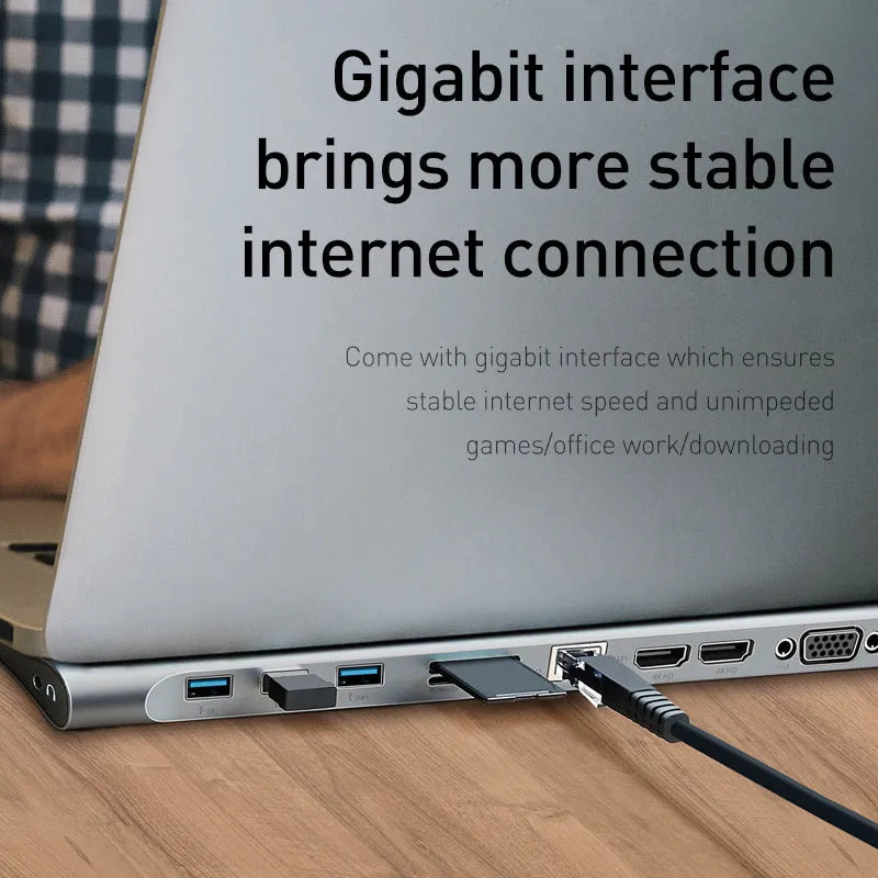 Grey aluminium USB-C docking station with cooling bracket showing multiple ports including HDMI and network