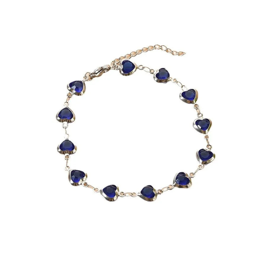 Devil's Eye Creative All-match Fashion Heart Bracelet in stainless steel on a wrist.