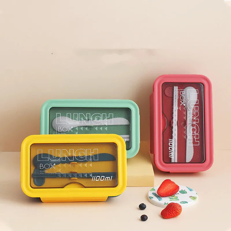 Green Nordic-style plastic bento lunch box with four separate food compartments.