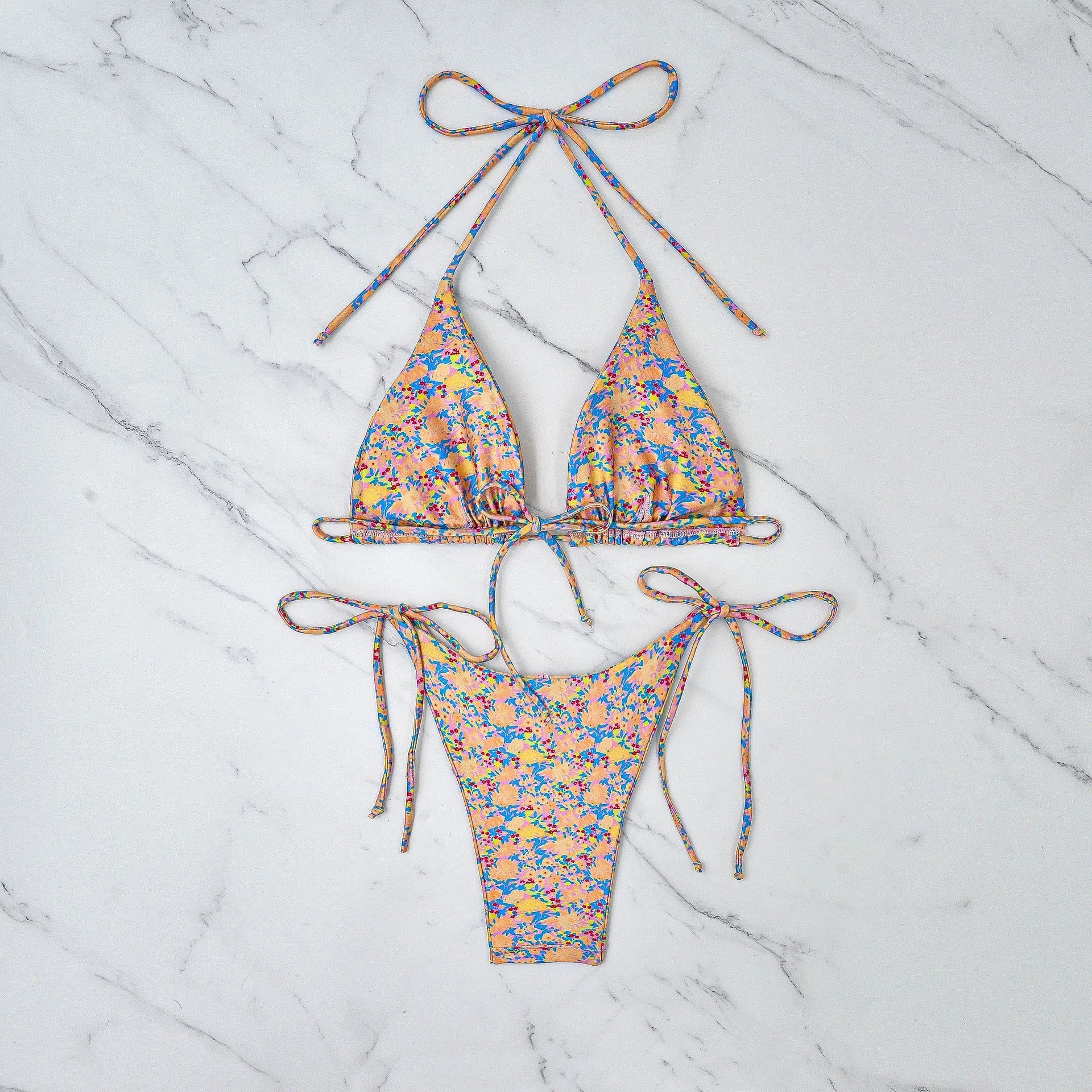 Women's lace-up bikini swimsuit with backless design and split briefs in polyester fabric