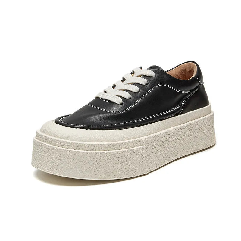 Women's black platform board shoes with embossed cowhide leather upper and round toe design