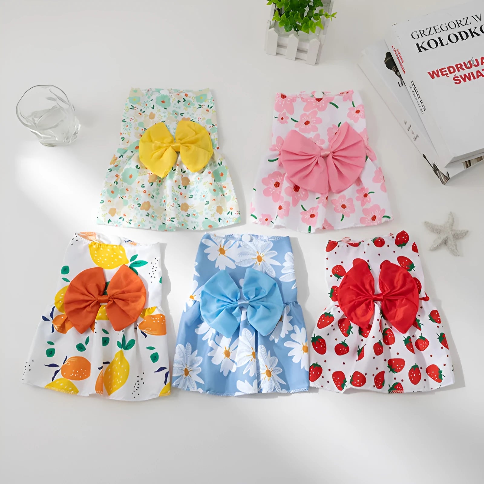 Ultra-thin floral butterfly knot princess dress for a dog or cat, with a decorative bow, on a white background.