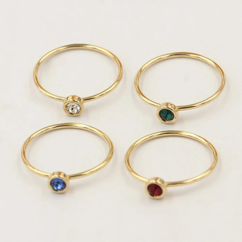 Women's 14K gilded copper zircon ring in green, blue, dark red, and white colour options.