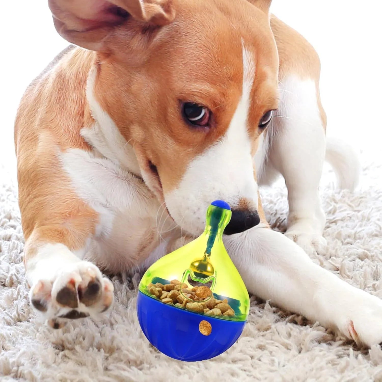 Light grey interactive pet treat dispenser ball with tumbler shape on a wooden floor.