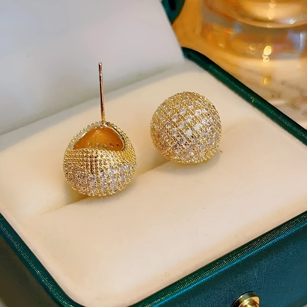 Geometric drop-shaped women's earrings with full diamond detailing and golden bean elements