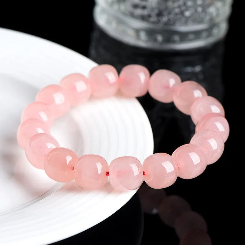 Pink crystal barrel bead bracelet with geometry design on wrist