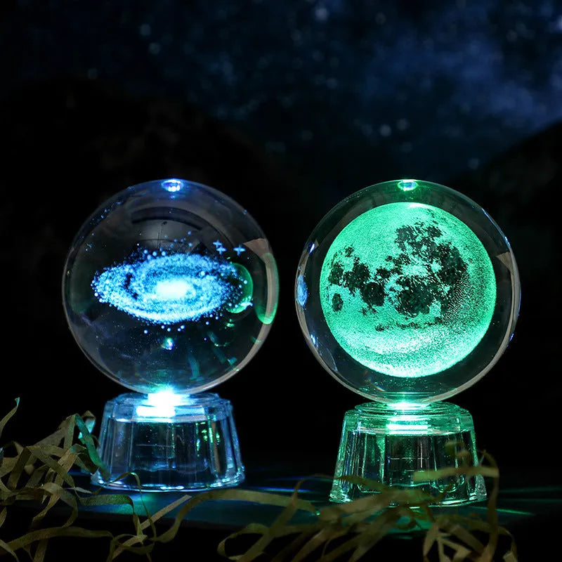Transparent 6cm crystal ball ornament with internal laser carving and LED illumination on fixed base