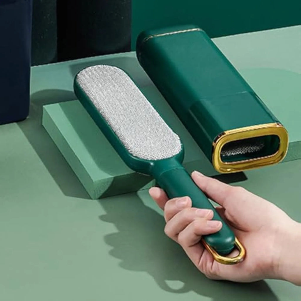 Blue, green, and white pet hair remover brush with double-sided head and storage base.
