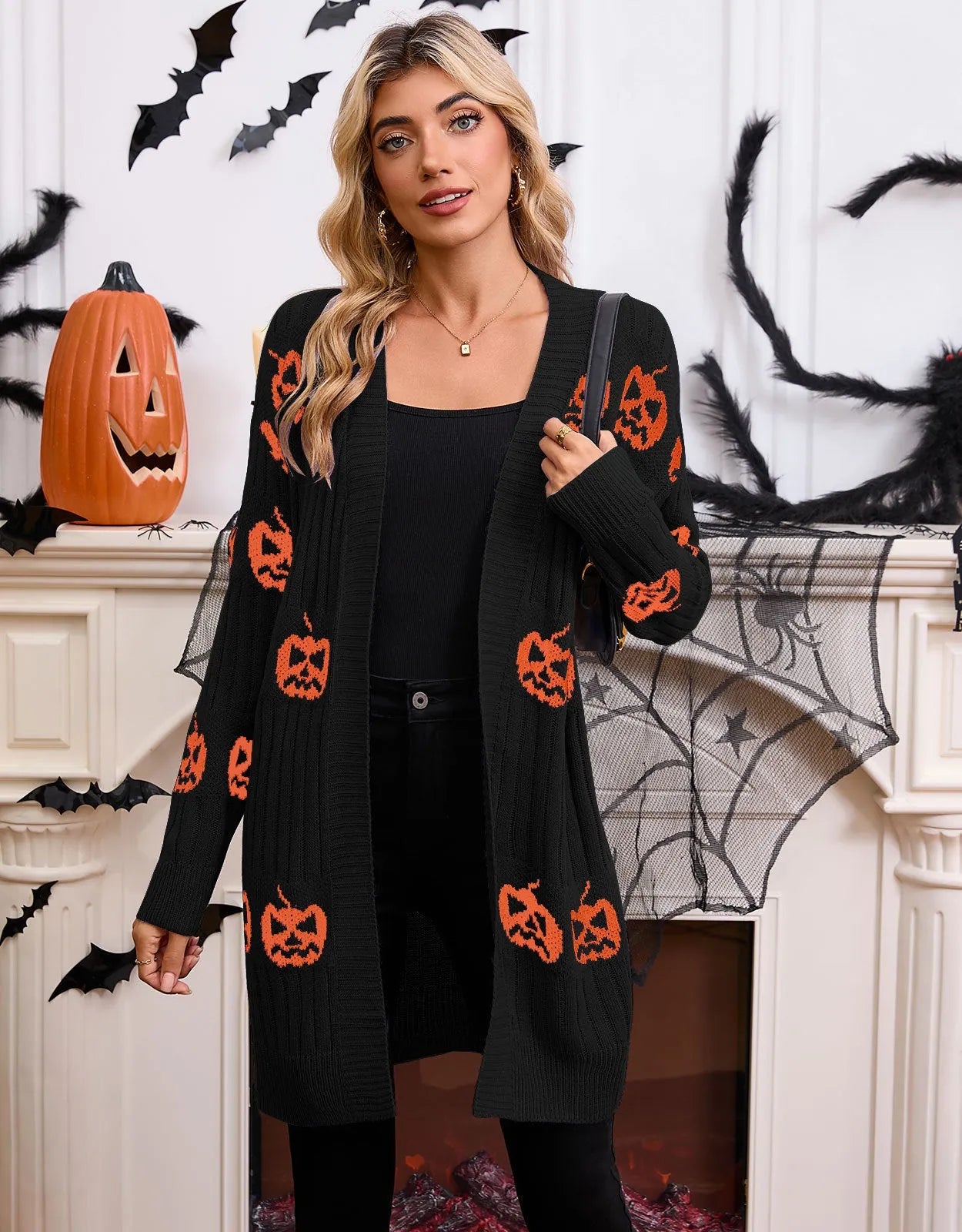Women's black Halloween cardigan with orange pumpkin head jacquard pattern, medium length