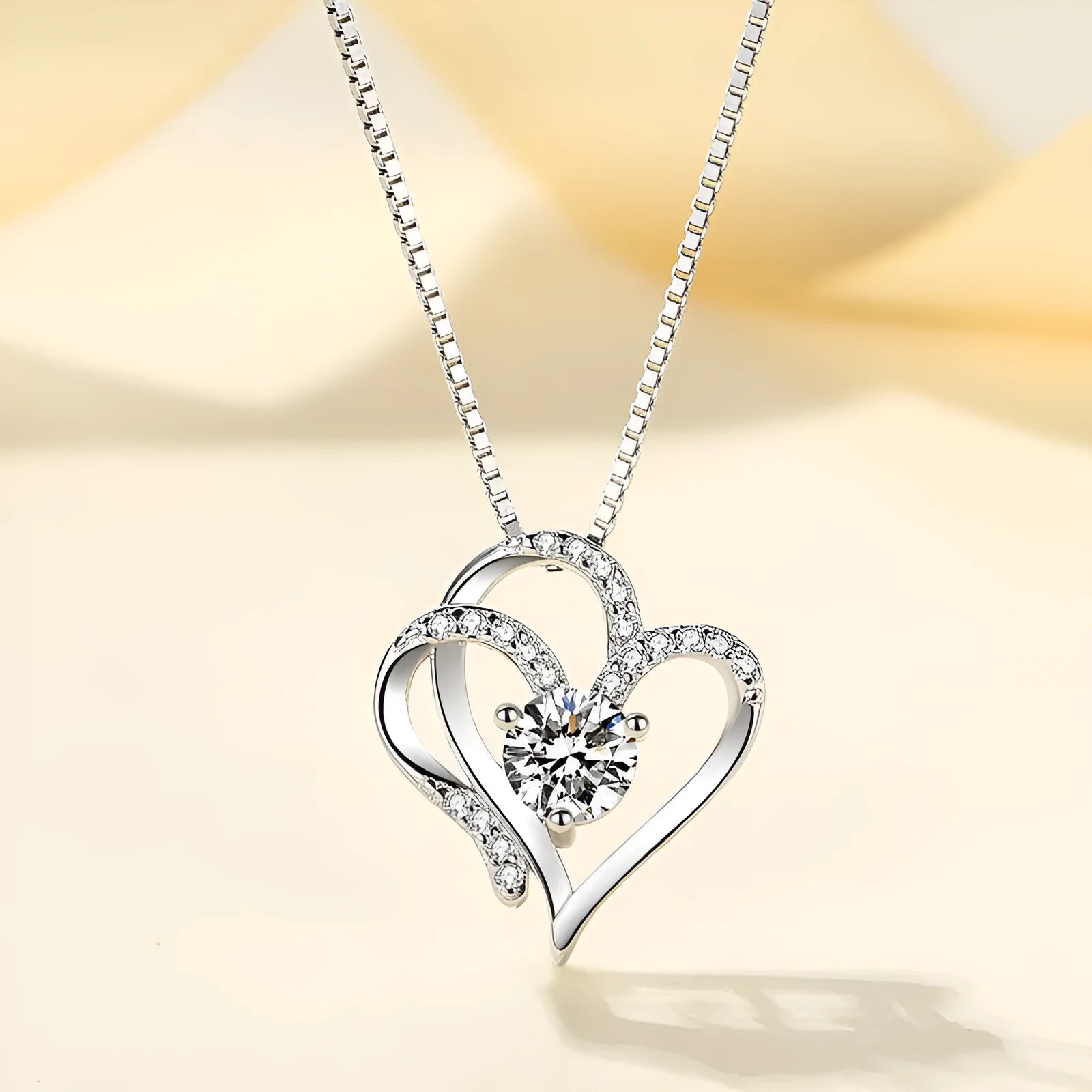 Women's heart-shaped 925 silver necklace with diamond treatment in rose, white, or yellow gold.