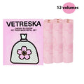 Portable dog poop bag dispenser capsule with a roll of 15 scented, thickened waste bags in cherry blossom print.