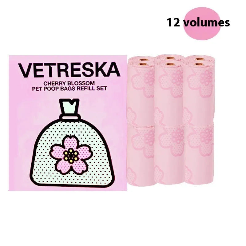 Portable dog poop bag dispenser capsule with a roll of 15 scented, thickened waste bags in cherry blossom print.