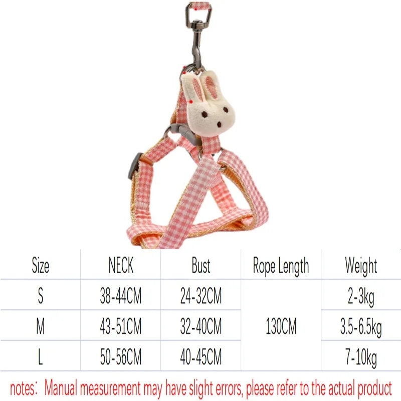 Blue nylon small dog harness with quick-release buckle and attached leash on a white background.