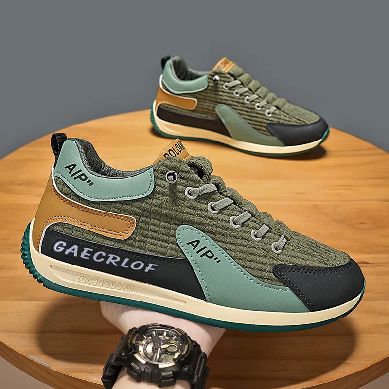 Men's grey and green mesh running shoes with lace-up closure and round toe design