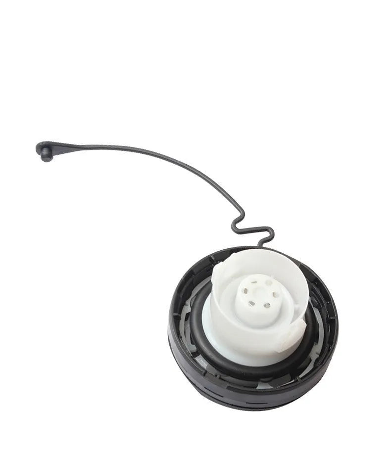 Toyota replacement snap-in fuel tank cap showing black plastic construction
