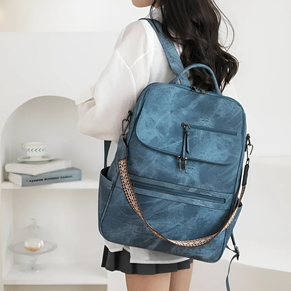 Retro college students backpack with curved shoulder straps in six colour options including black, blue, and yellow apricot